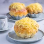 ensaymada with grated cheese on top