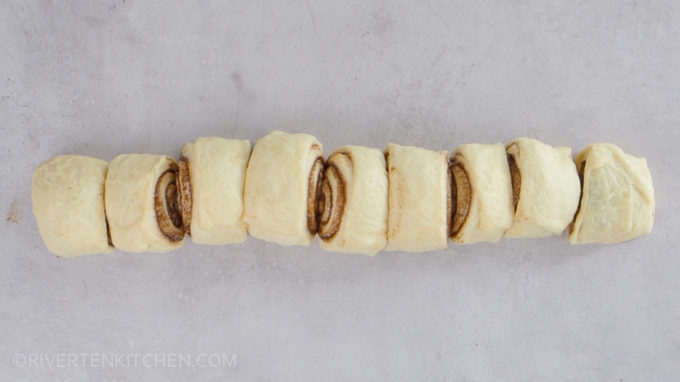 cutting cinnamon rolls dough