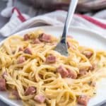 Creamy ham and cheese pasta on a plate