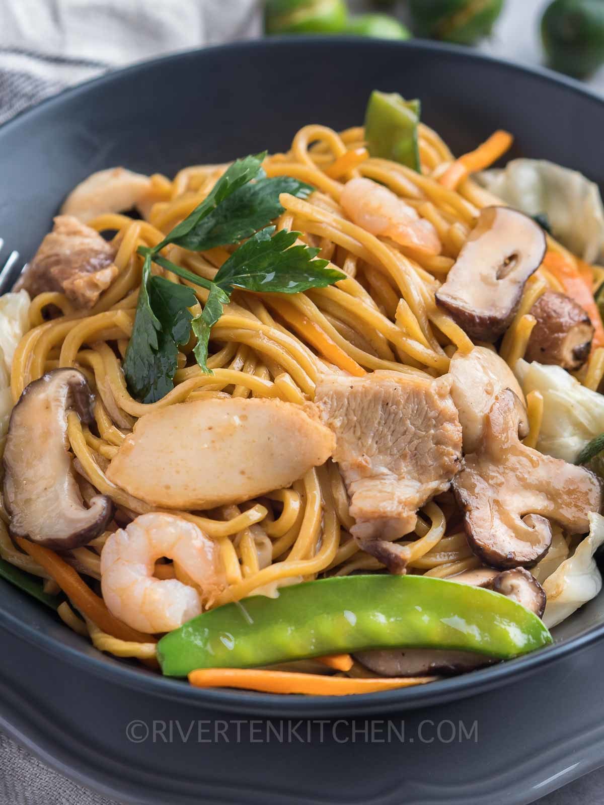 Filipino stir-fried yellow noodles with vegetables