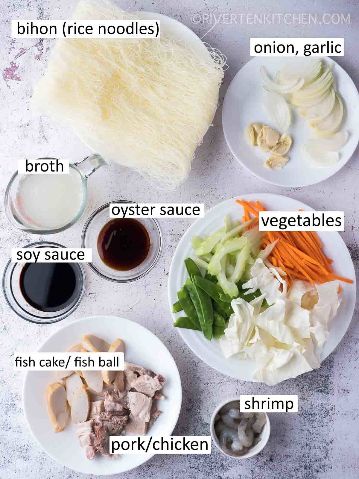 pancit ingredients - rice noodles, sauce, vegetables, pork and shrimp