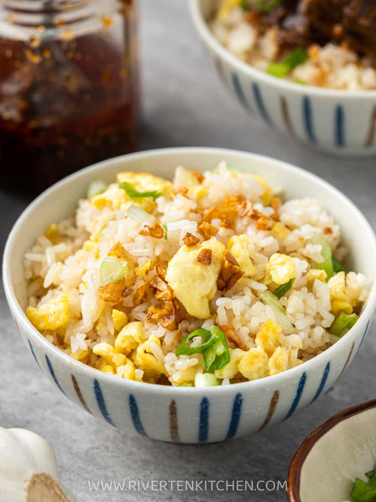 garlic fried rice with egg in a small bowl