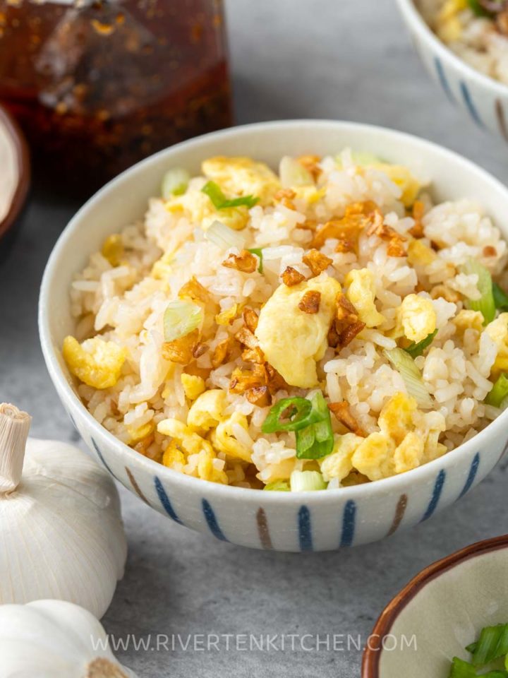 garlic fried rice with egg in a small bowl