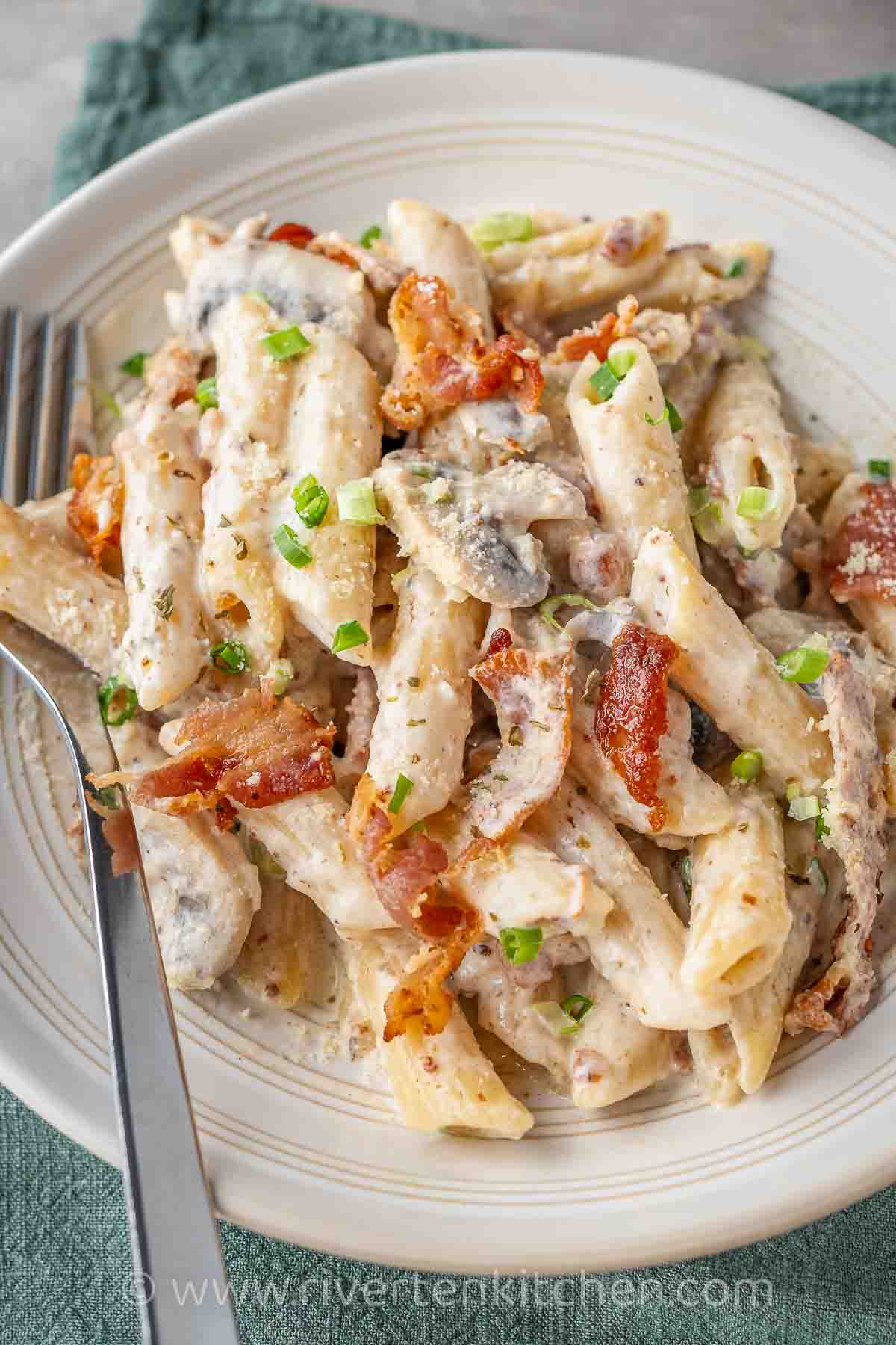 creamy penne pasta with bacon, mushroom, and garlic.