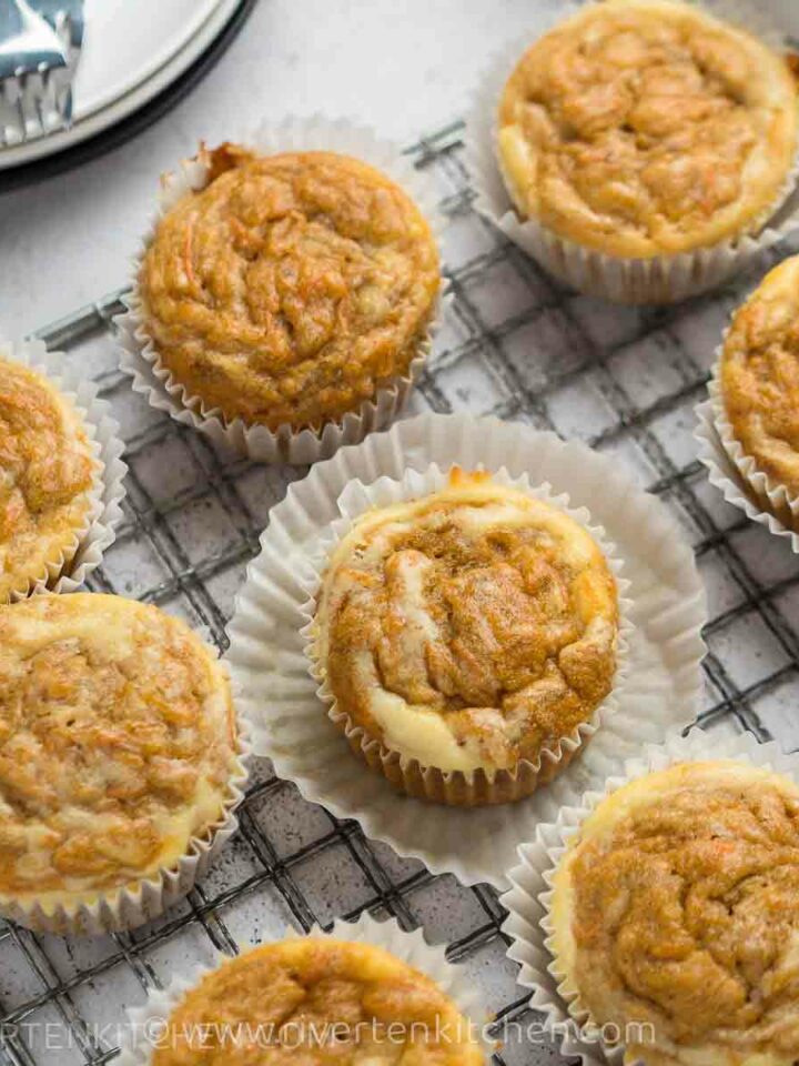 muffins made of carrots and banana with cream cheese topping.