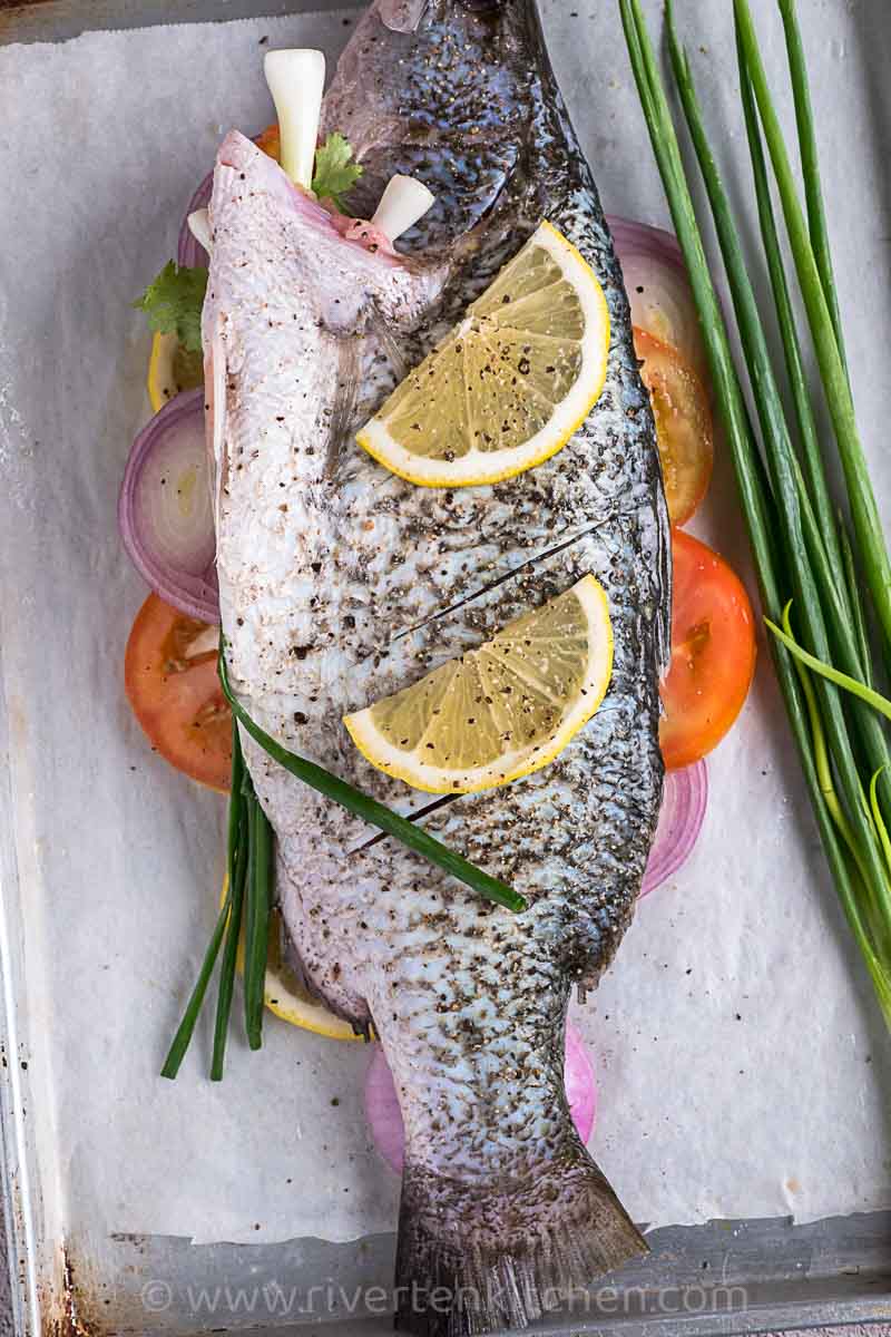whole fish stuffed with onions, tomatoes, lemon and onion leaves.
