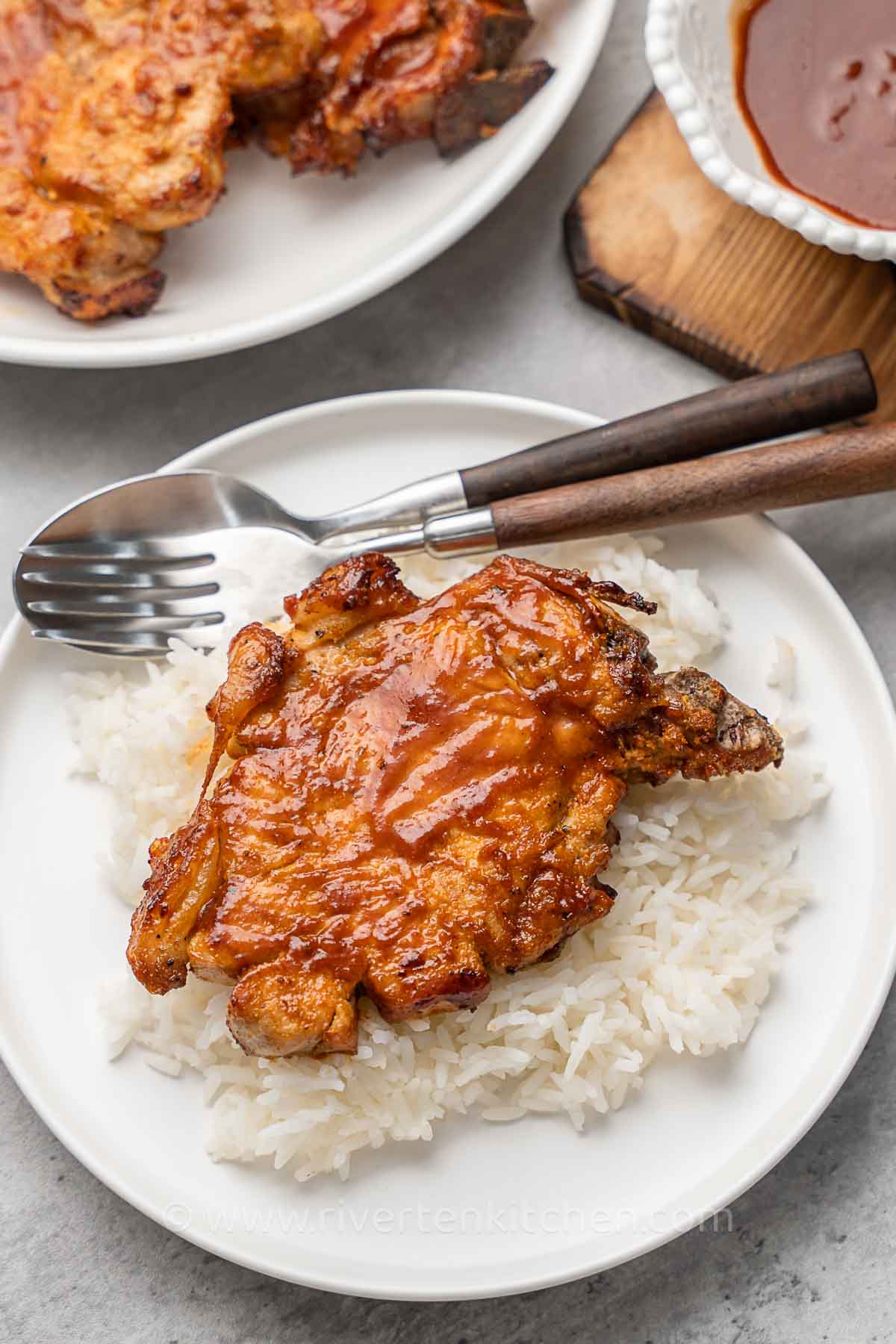 BBQ pork chops served with white rice.