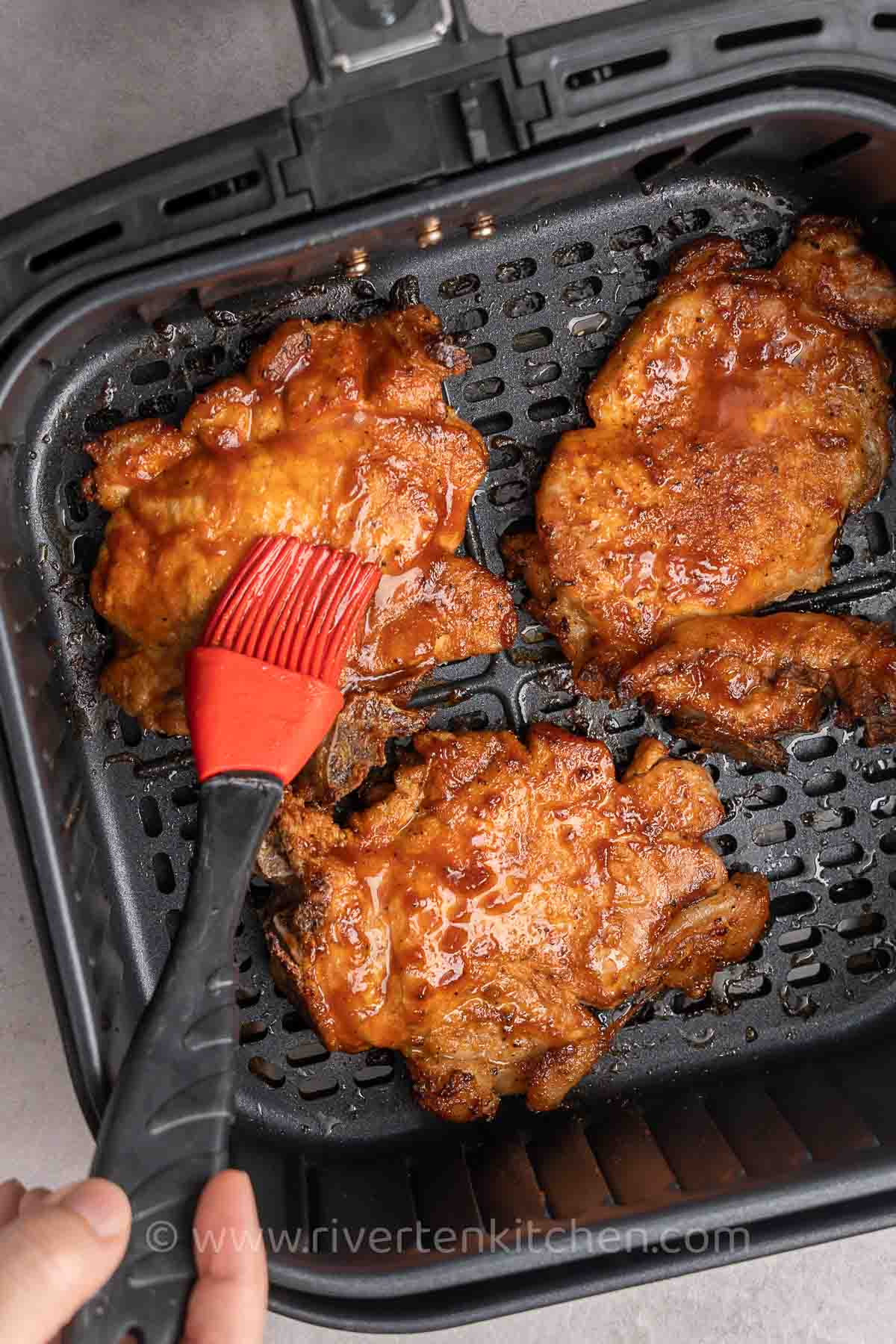 Pork chops with barbecue sauce.