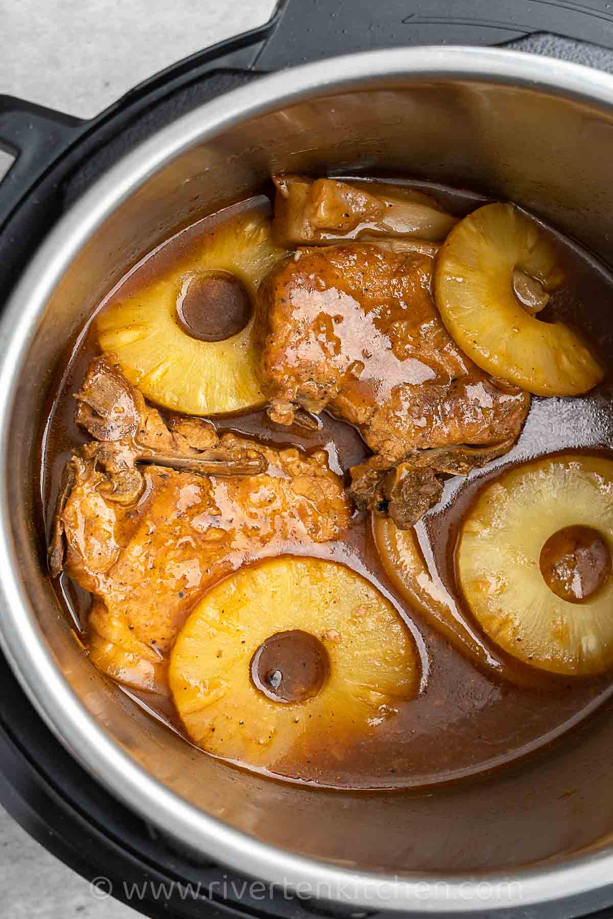 pineapple pork chops cooked in an Instant pot pressure cooker.