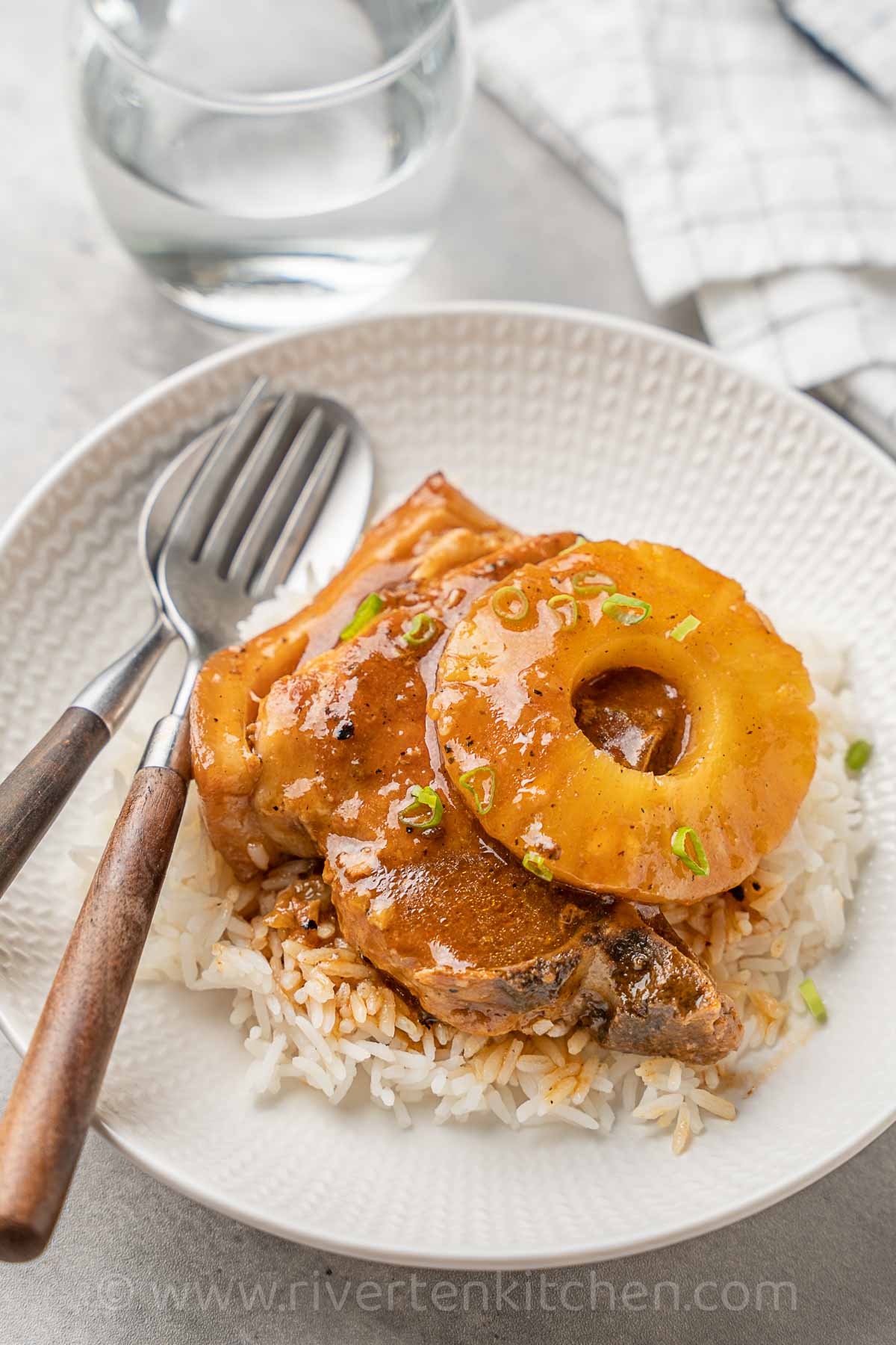 pineapple pork chops served with white rice.