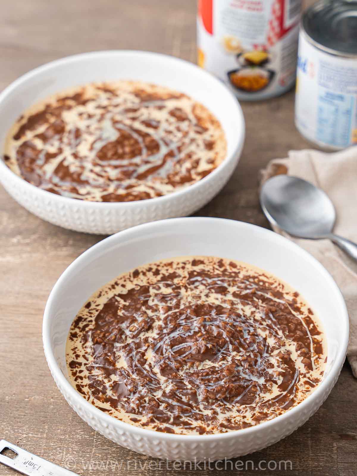 Chocolate porridge called Filipino Champorado. This is made of sticky glutinous rice and oatmeal drizzled with evaporated milk and condensed milk.