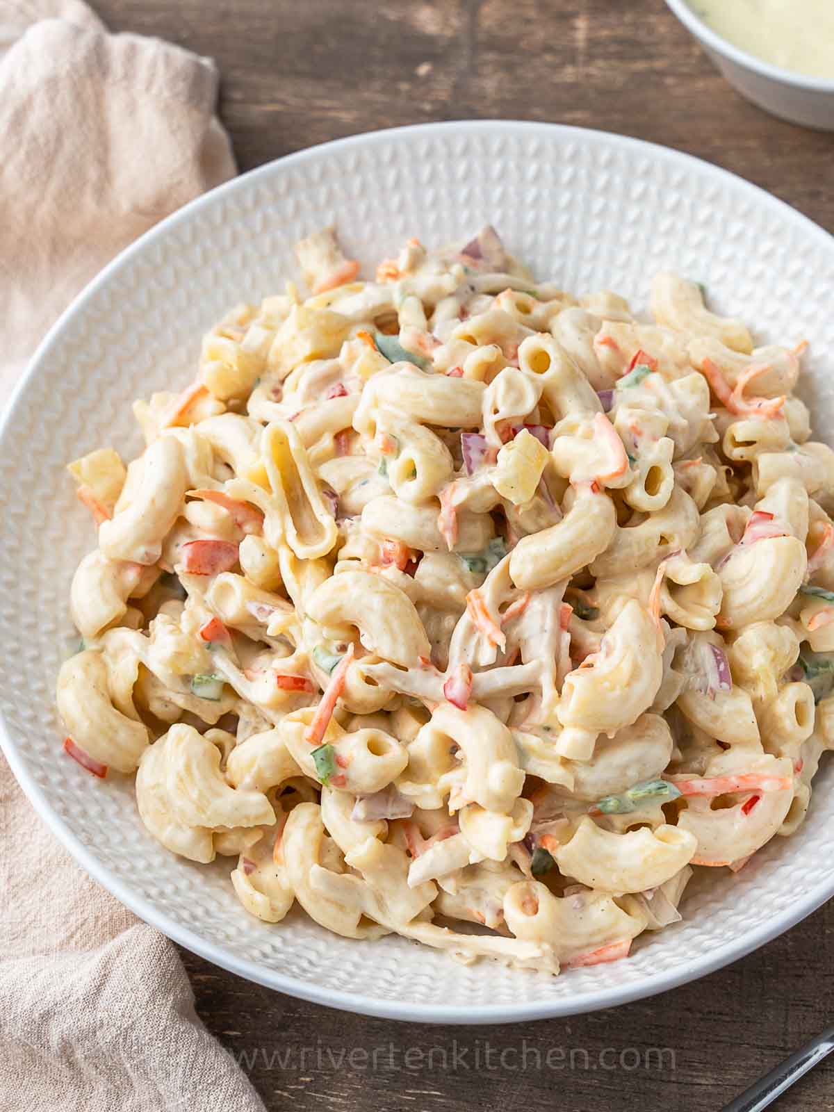 creamy pasta salad with chicken and vegetables.