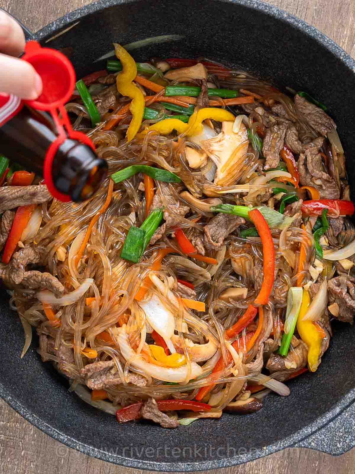 Japchae Korean noodles with beef and vegetables cooked in one pan.