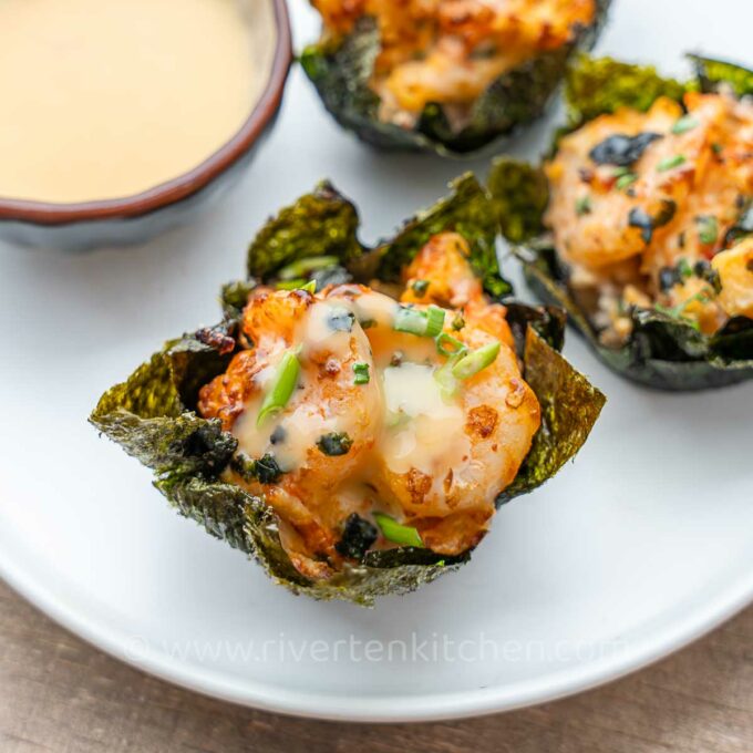 sushi bake rice with shrimp and imitation crab in muffin pans.