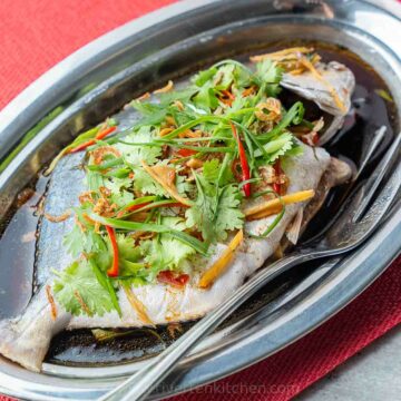 steamed fish with soy ginger sauce Chinese style.