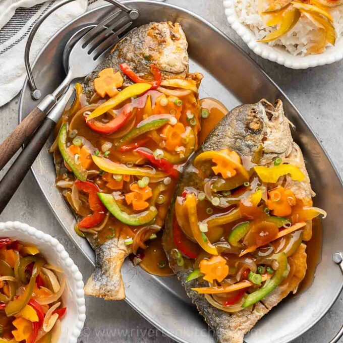 sweet and sour made of whole fish with carrots and bell peppers.