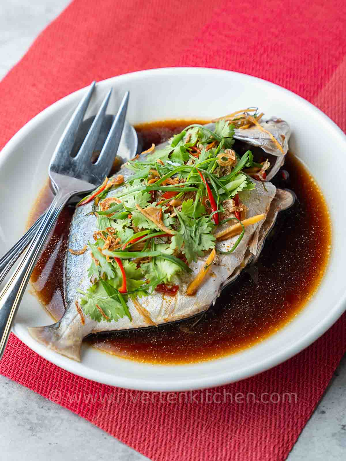 Steamed Fish made of pompano or pomfret with Chinese sauce