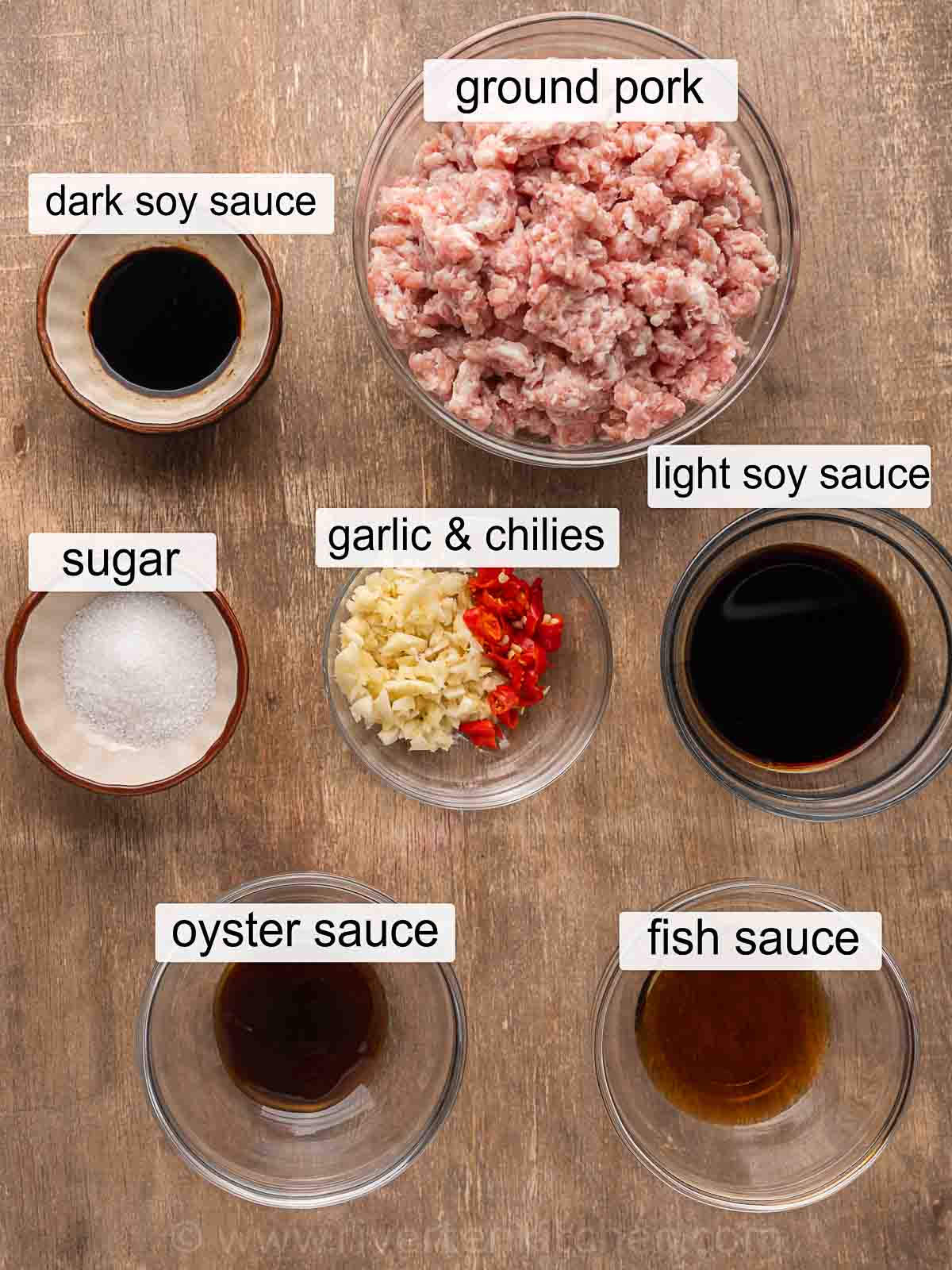 ground pork, fish sauce, oyster sauce, sugar, dark soy sauce, fresh garlic, red chilies and light soy sauce.