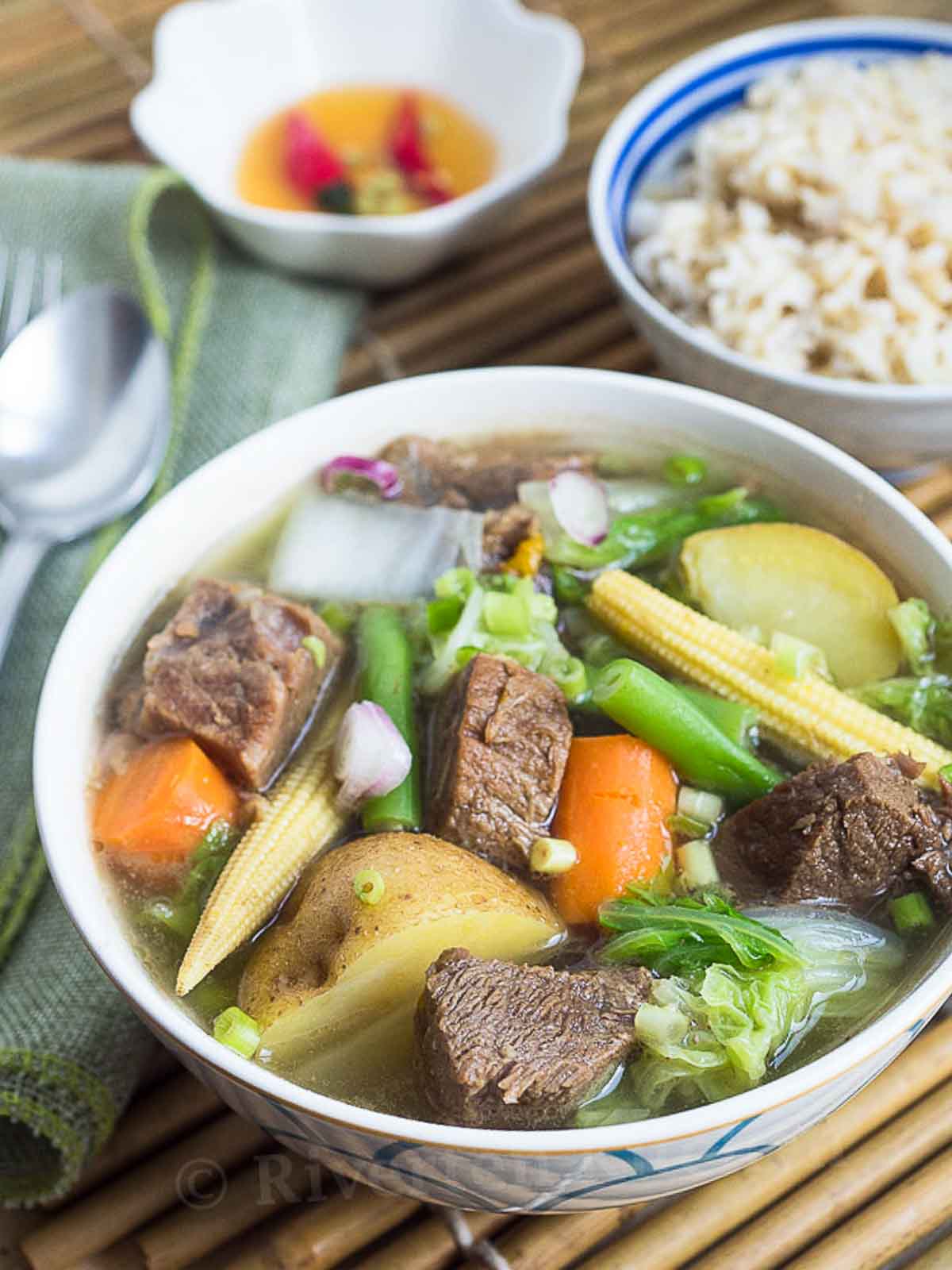 clear beef soup with vegetables.