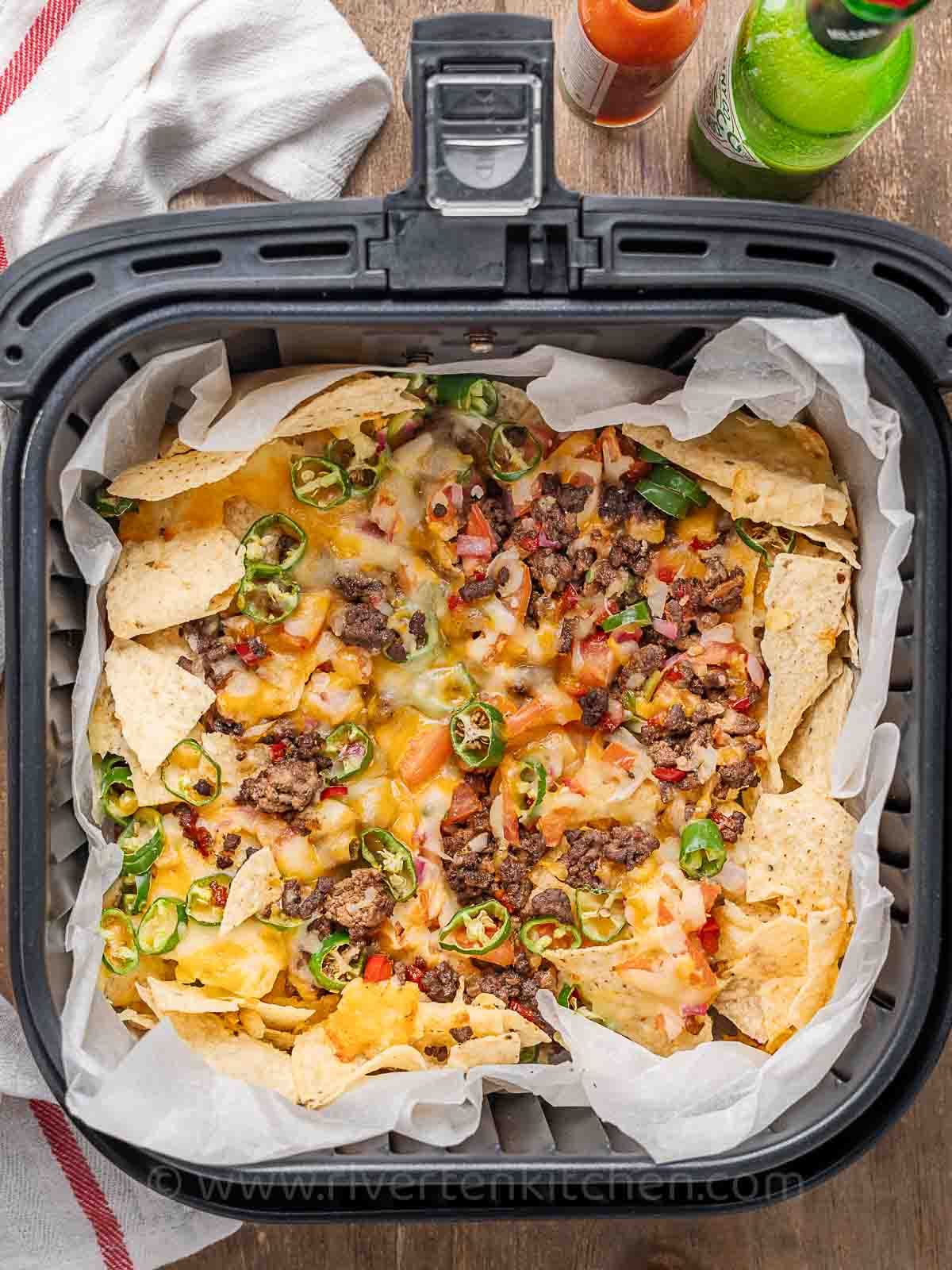 ground beef nachos with melted cheese cooked in an air fryer.