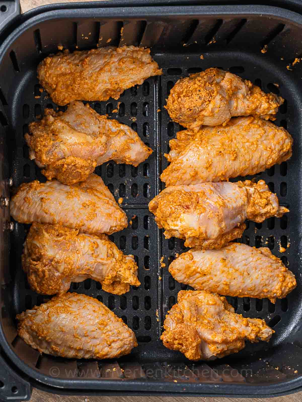 chicken wings seasoned with paprika, salt, garlic, cornstarch, and baking powder.