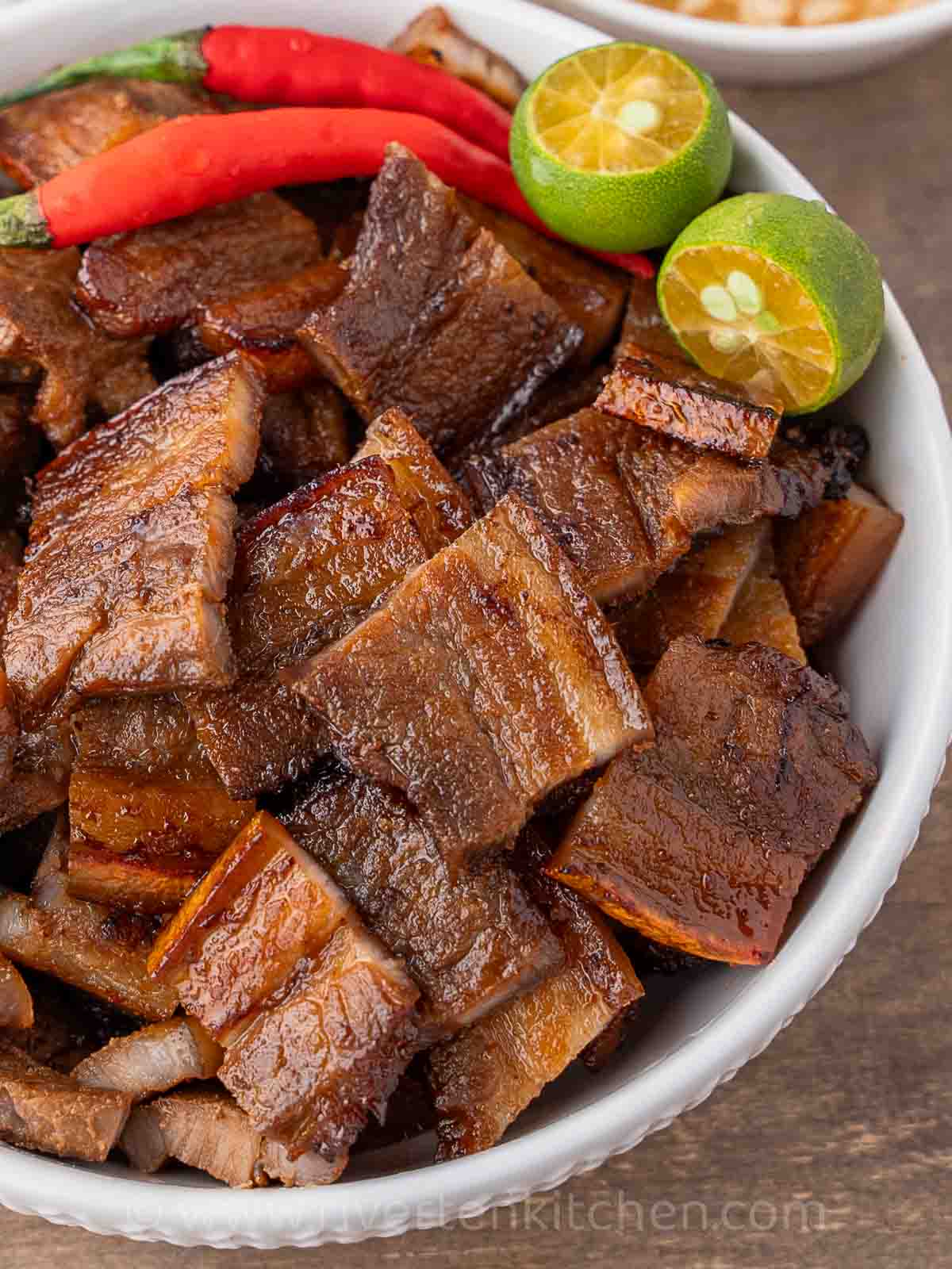 Grilled pork belly in a bowl.
