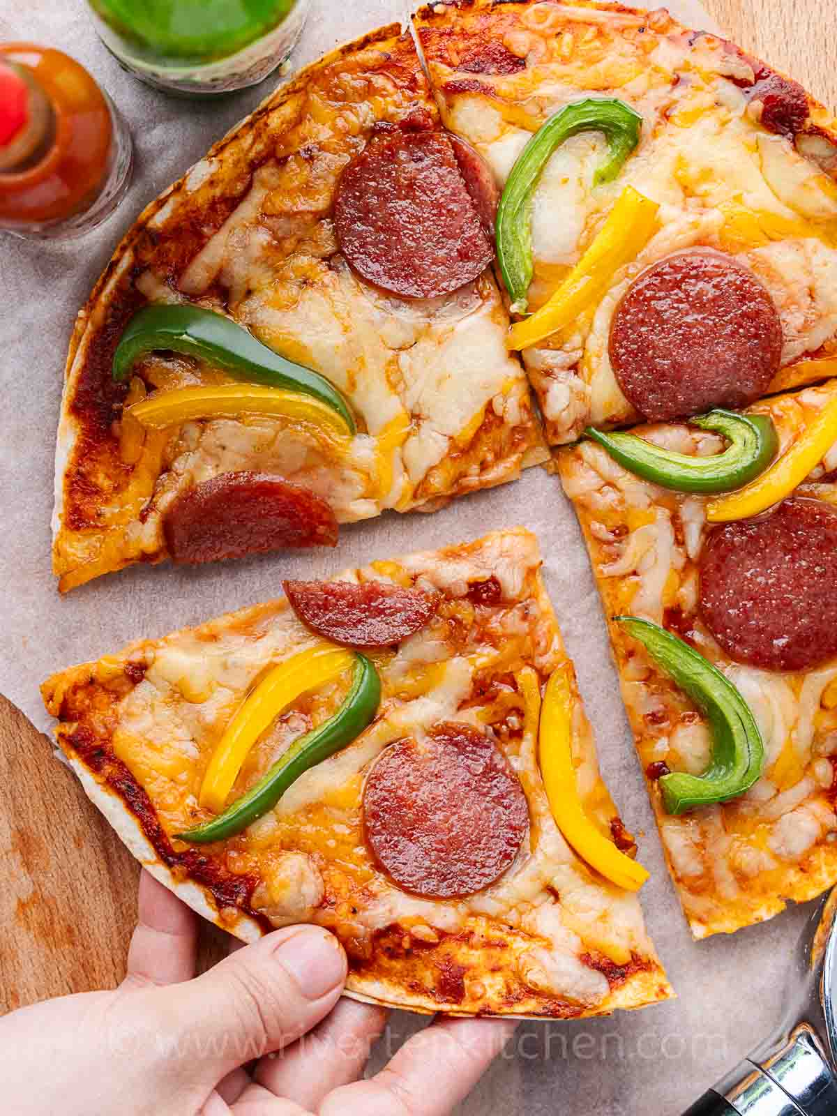 air fryer tortilla pizza with salami and bell pepper.